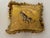 A handsome Fortuny silk pillow with an embroidered tiger in the center. Tassel fringe in alternating yellow and gold....