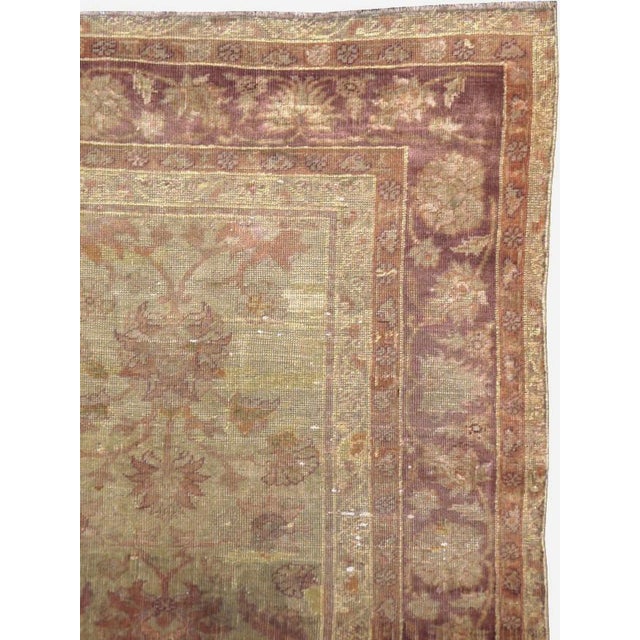 An antique Turkish Oushak accent rug. Definitely in the 1920’s Mahal style, with a central palmette axis and rounded...
