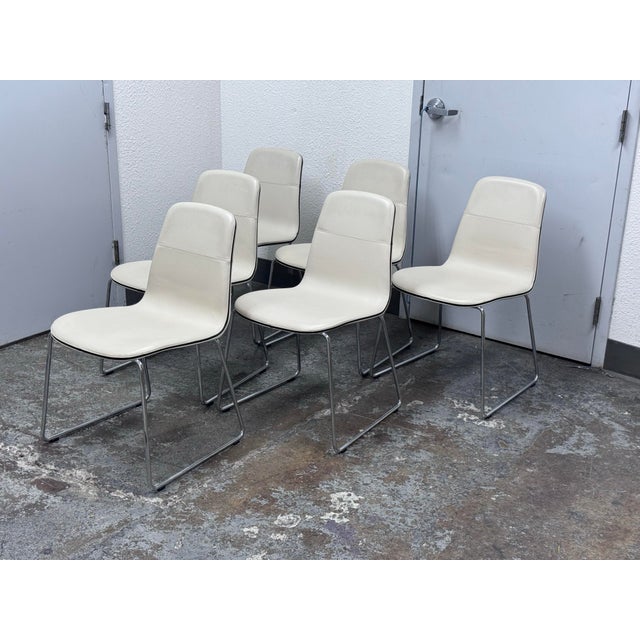 Design Plus Gallery presents a Set of Six 2Leather Seat Dining Side Chairs by Rodolfo Dordoni for Matteograssi. The...