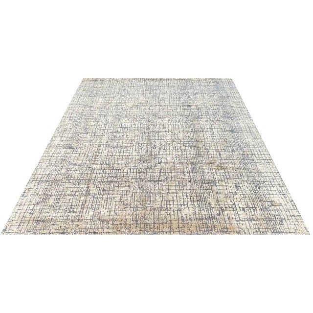 Exact Size: 8'0" x 10'3" Color: Gold Age: New Materials: Wool, Bamboo Silk Construction: Hand Knotted Origin: India