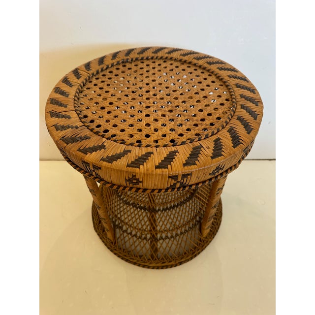Vintage Peacock drum shaped woven rattan and wicker side table. Wonderful pattern and versatile addition to a room for...