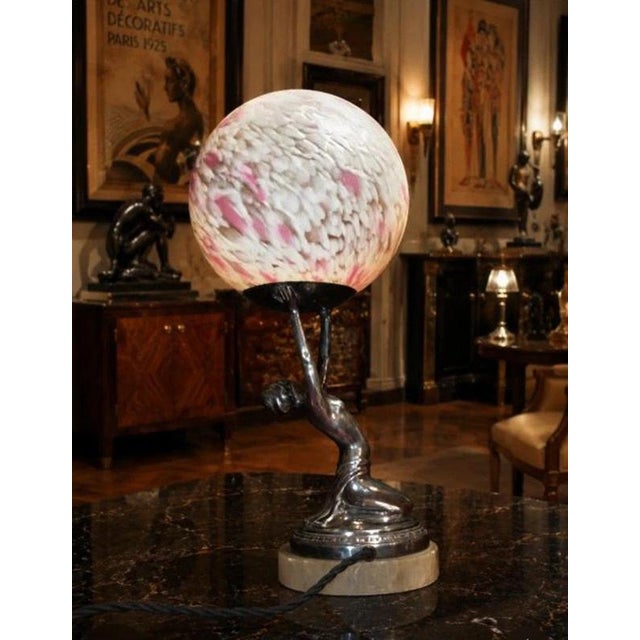 A glamorous original French Art Deco figural table lamp dating to circa 1930, combining a sculptural female dancer with...
