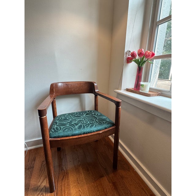 This is a beautiful vintage solid wood armchair featuring a classic barrel-back/banker-style silhouette. This sturdy chair...