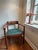 This is a beautiful vintage solid wood armchair featuring a classic barrel-back/banker-style silhouette. This sturdy chair...