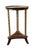Planked round top with gallery edge detail and three pairs of faux bamboo legs, one shelf at bottom. Chinoiserie depicting...