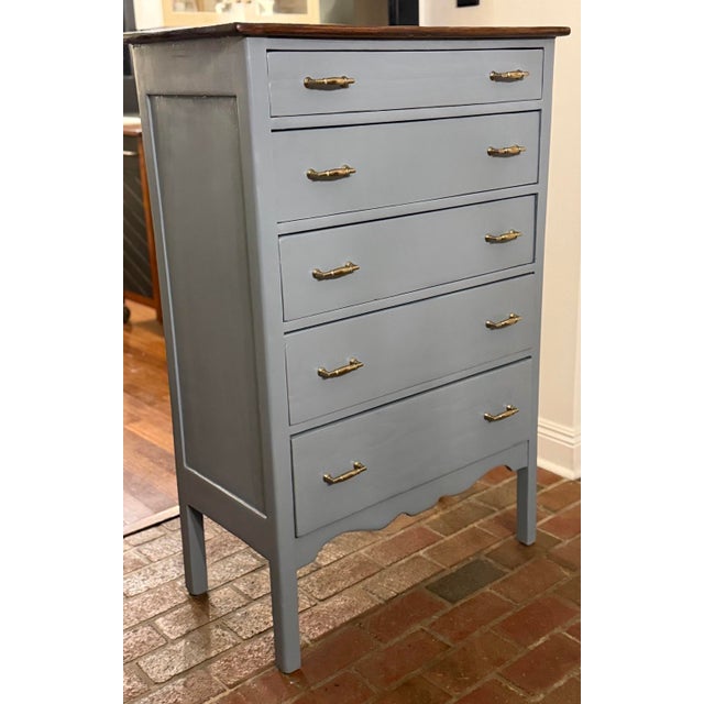 A beautifully reimagined vintage solid wood tallboy dresser featuring classic proportions, elegant detailing, and a...