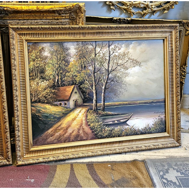 Bring the peaceful beauty of the countryside into your home with this charming landscape painting depicting a tranquil...