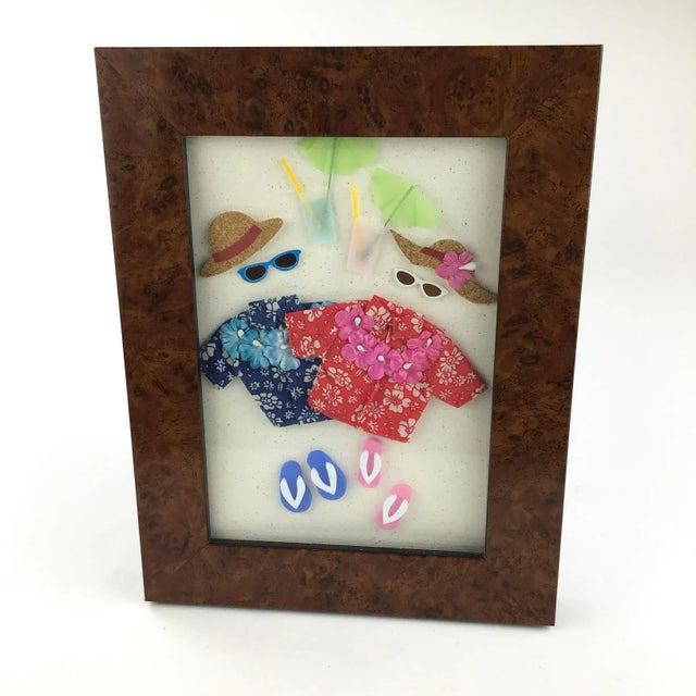 A very pretty and functional frame for photos or even some 3 dimensional art. We framed a card to show how it looks....