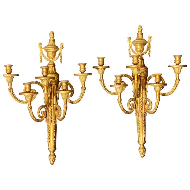 Pair of Adams style five arm tassel decorated dore bronze wall candelabras. Price is for one pair only.