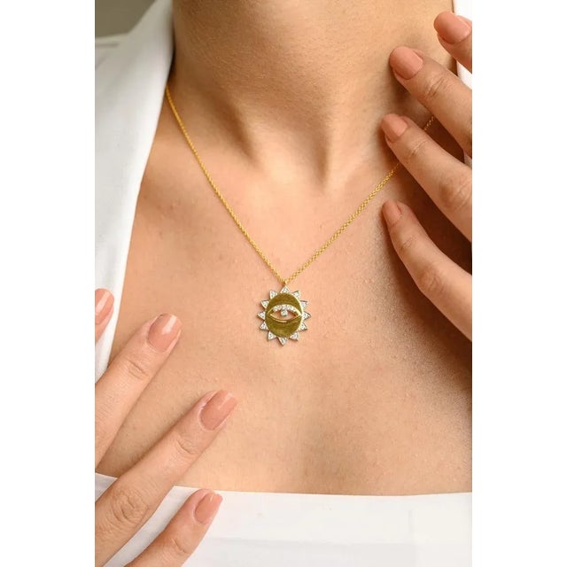 This is part of Chairish’s Fine Jewelry assortment. Evil Eye Medallion Diamond Necklace in 18K Gold studded with round cut...