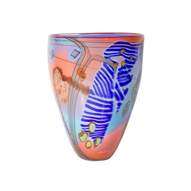 A Colorfield art glass vase by American artist Wes Hunting (born 1958). This vase features a blue, red and yellow abstract...