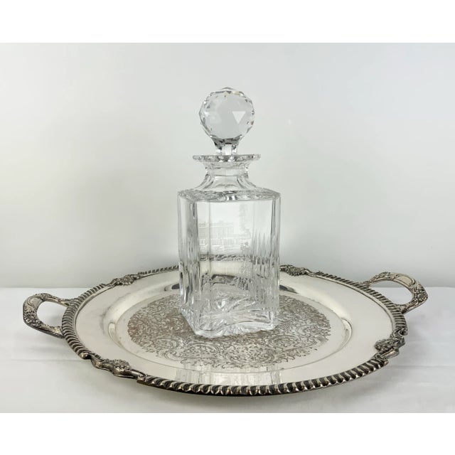 A stunning square crystal decanter from Royal Brierley. Handmade in England and exquisitely detailed with an English...