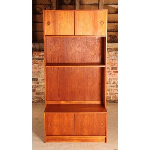 Danish Mid Century teak bookcase, circa 1960s. Cabinet sections on top and bottom with sliding doors. Excellent restored...
