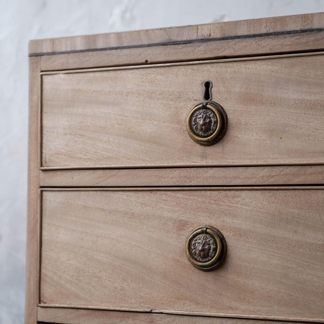 Bleached George III mahogany chest of drawers, circa 1810. Five-drawer chest with two short upper drawers over three...