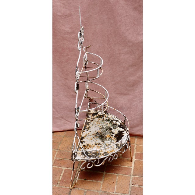 Antique Wrought Iron 3 Tiered Plant Stand. The stand can be free standing or wall mounted.
