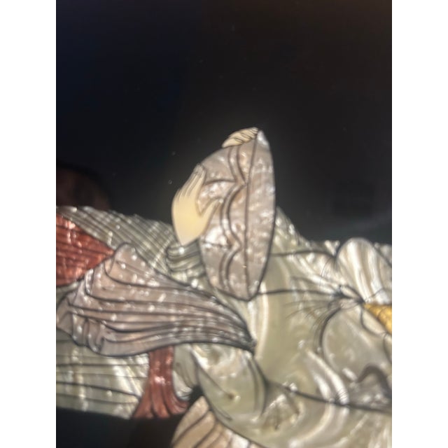 Mid 20th century Asian decorative wall panel featuring a finely detailed mother=of- pearl inlay of a female figure in a...