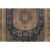 Hand-knotted in wool and originating circa 1870-1879, this 6x10 antique Khotan rug features two geometric medallions on a...