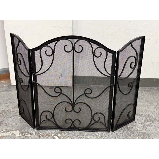 Design Plus Gallery presents an Iron Fireplace Screen. This is likely a vintage piece that is made of cast iron. It is a...