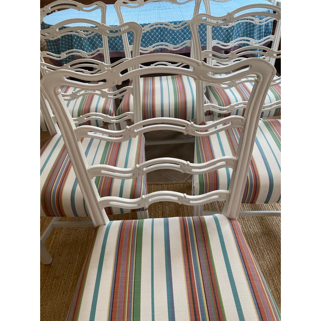 SET OF SIX CHIPPENDALE-STYLE RIBBON-BACK DINING CHAIRS Mid-20th Century In mahogany. Seats newly reupholstered with...