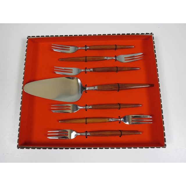 Dutch mid-century cake serving set by Amefa, produced in the Netherlands in the 1960s. The ensemble comprises six dessert...