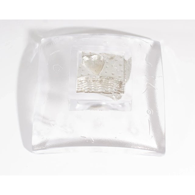 A glass dish from the Domino series designed by the Swedish glass artist Bertil Vallien (born 1938) for Kosta Boda. Square...