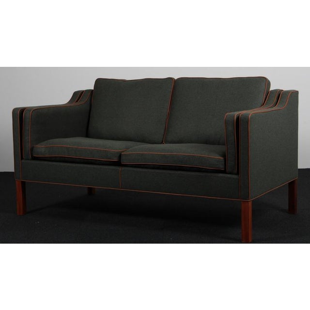 Børge Mogensen two-seat sofa new upholstered with cognac full grain aniline leather tubings and bottle green Magrethe wool...
