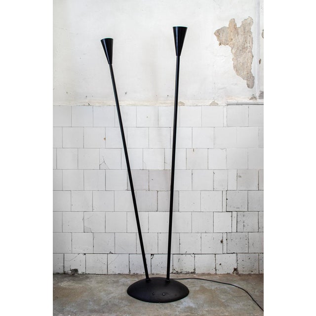 Two-light floor lamp in lacquered metal. Adjustable and swiveling. Model AeB Designer Paolo Deganello Manufacturer Ycami...