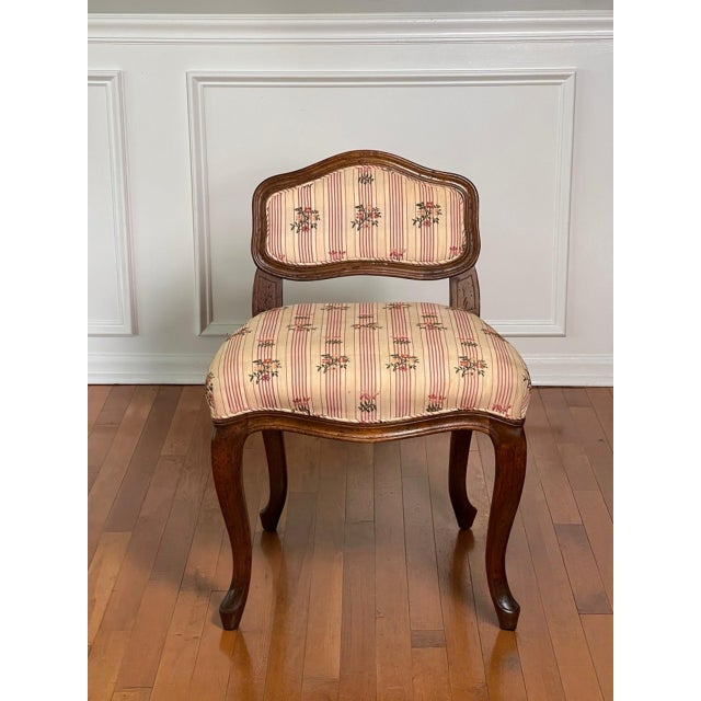 Elegant Louis XV style upholstered vanity or side chair in walnut by Don Ruseau. Beautifully handcrafted chair with a...