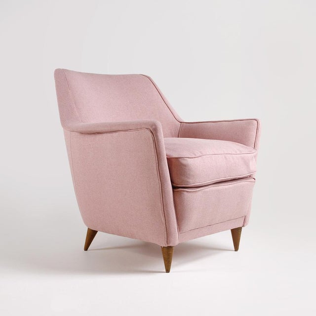 Pastel pink fabric armchair made in Italy between the 1950s and 1960s. Wooden frame and legs, upholstered in pastel pink...