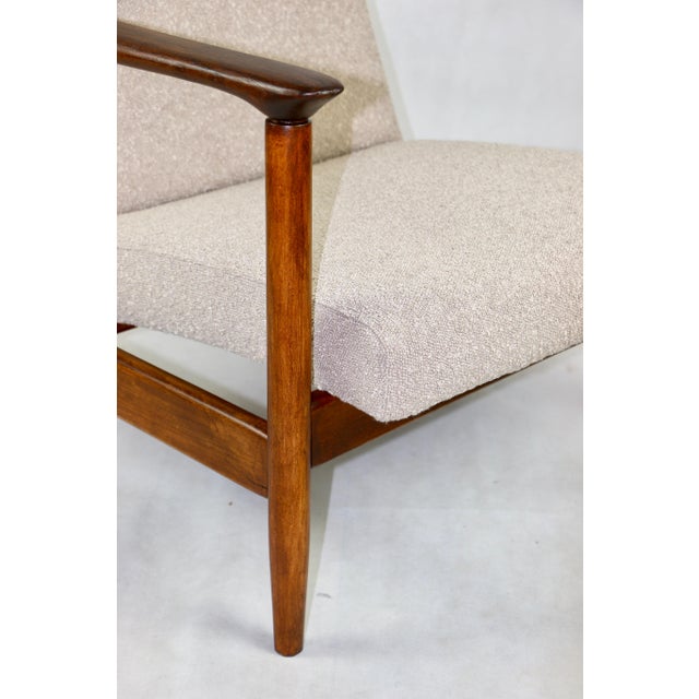 - A vintage easy chair - model GFM-142 - Designed by Edmund Homa - from the 1970s - Reupholstered in structural fabric in...