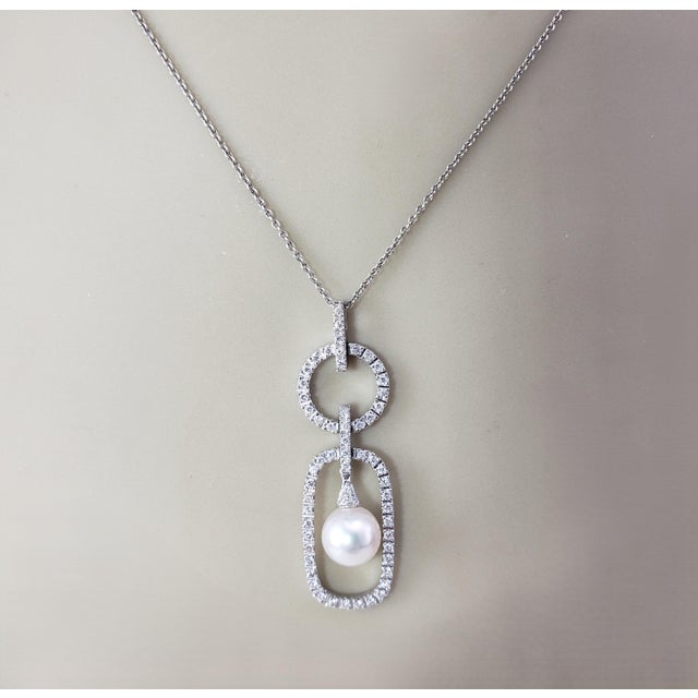 18K White Gold Diamond and Pearl Pendant- This stunning pendant features 59 round brilliant cut diamonds and one round...