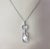 18K White Gold Diamond and Pearl Pendant- This stunning pendant features 59 round brilliant cut diamonds and one round...