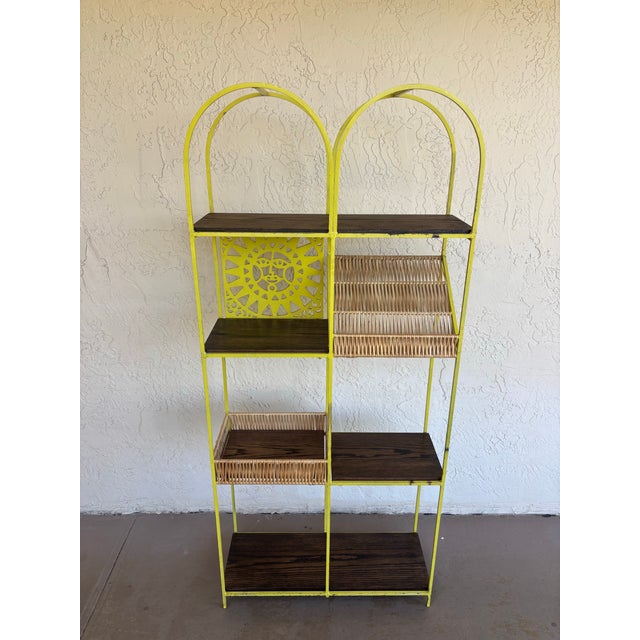 Striking vintage Arthur Umanoff shelving unit dating to the 1960s. Constructed with a solid iron frame featuring a...