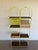 Striking vintage Arthur Umanoff shelving unit dating to the 1960s. Constructed with a solid iron frame featuring a...