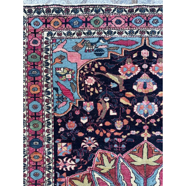 Discover a stunning early 20th-century rug that exudes elegance! This exquisite piece features a captivating floral and...