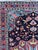 Discover a stunning early 20th-century rug that exudes elegance! This exquisite piece features a captivating floral and...