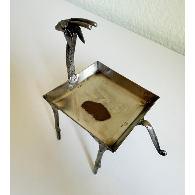 Late 20th-century forged steel figurative dish/pedestal/votive candle holder, handcrafted in the form of a stylized...