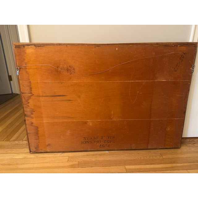 Midcentury modern wall mirror made of walnut and pecan. Sold to me as a Kent Coffey, but unlabeled. It is certainly...