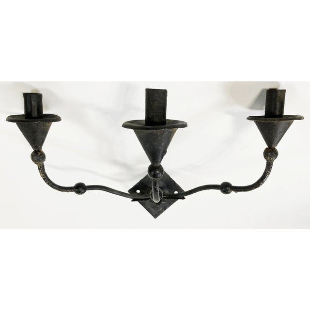 Unique vintage sculptural mid-century modern iron non-electrified wall mount candelabra in the style of Giacometti. Sconce...