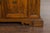 An Italian walnut credenza from the 18th century, with four drawers and two petite doors. Introducing an exquisite piece...