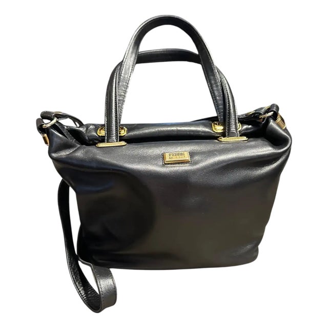 A 1990s Elegant Black Leather and Brass Italian Hand-Bag by Gianfranco Ferrè For Sale