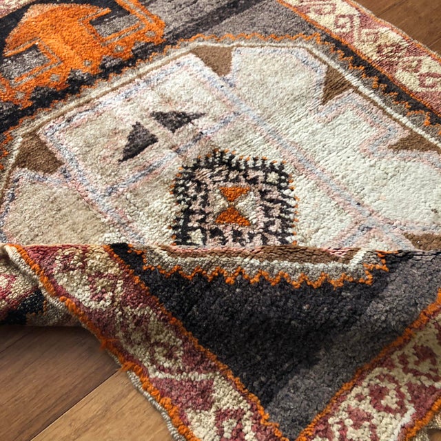 A Vintage Turkish Kars Rug with Geometric Medallion This distinctive vintage Turkish Kars rug is a refined expression of...