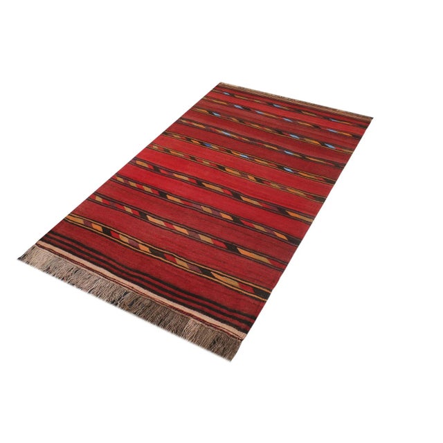 "Add a touch of elegance to your home with this Vintage tribal Kilim rug. Constructed on a loom by Nomad Turkman people...