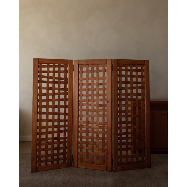 The piece stands out for its solid-wood frame and traditional joinery details (visible frame construction and clean...