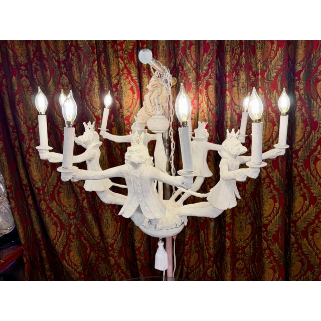 Whimsical ten-light composite chandelier almost certainly by Bill Huebbe (1929-2013) depicts five monkeys dressed as...