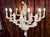 Whimsical ten-light composite chandelier almost certainly by Bill Huebbe (1929-2013) depicts five monkeys dressed as...