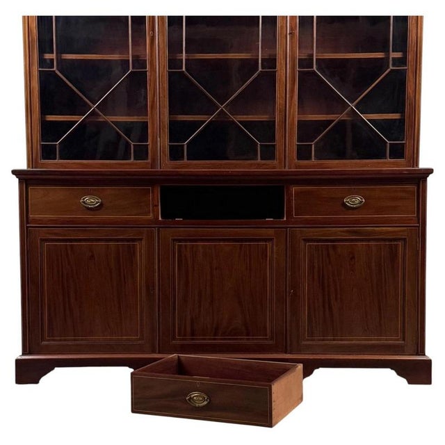 An exceptional and imposing 18th-century English Georgian bookcase, finely constructed in mahogany and distinguished by...