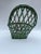 A single vintage small woven wicker or straw basket with an unusual shape suitable for hanging.