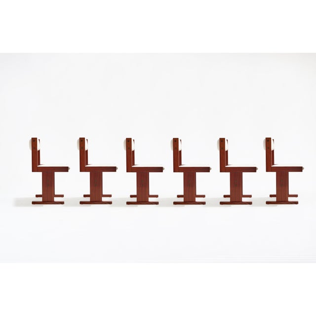 This set of six vintage rosewood dining chairs, designed by Poul H. Poulsen for Gangsø Møbler in 1960s Denmark,...