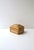A chic vintage wicker and linen jewelry or trinket box with a stepped, multi‑panel hinged lid, in the Modern style, circa...